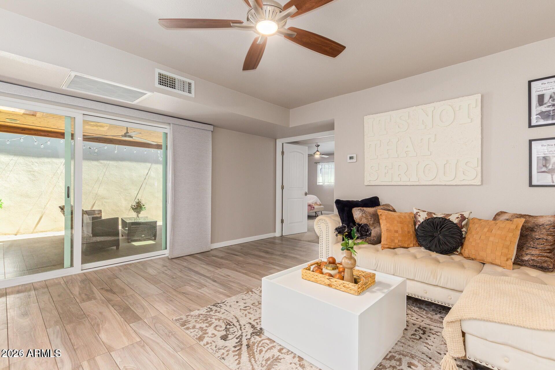 5913 East Thomas Road Scottsdale, AZ 85251 - Photo 8 of 26 a living room with furniture and a large window