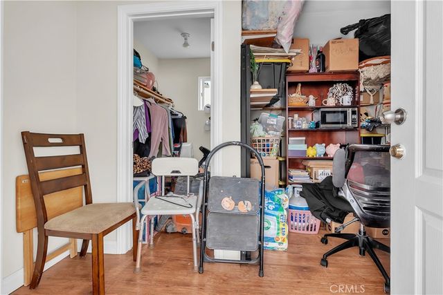 a view of a workspace with furniture and a workspace