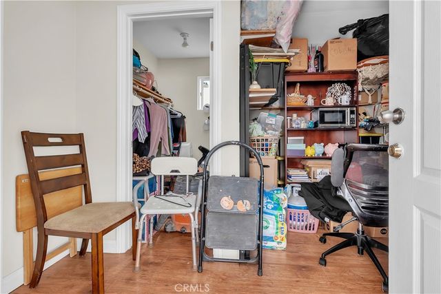 a view of a workspace with furniture and a workspace