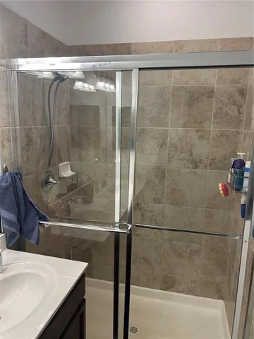 a bedroom with a bed a couch and a window