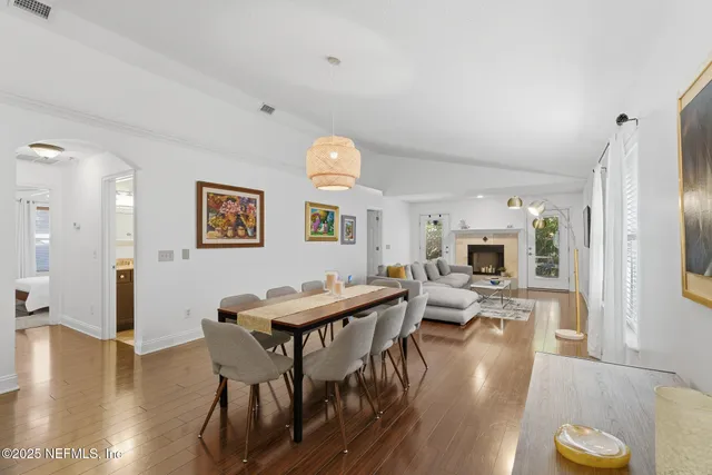 a bathroom with a granite countertop sink a mirror and a shower