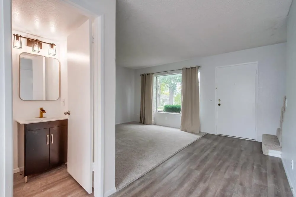 4178 Baycliff Way Oceanside, CA 92056 - Photo 8 of 27 a view of a bathroom from the hallway