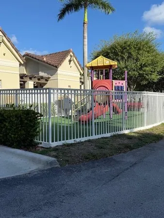 a view of a wrought iron fences in front of house