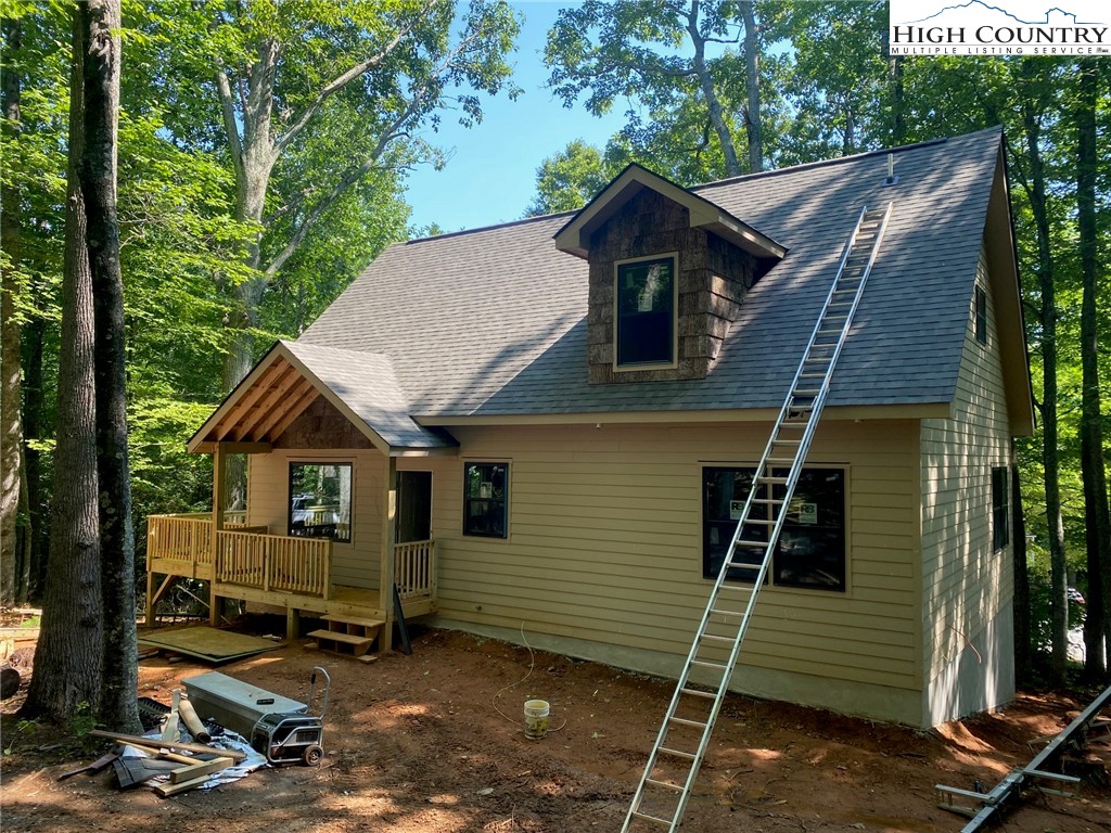 Spicewood Drive Drive Boone, NC 28607 - Photo 3 of 13 a front view of a house with a yard