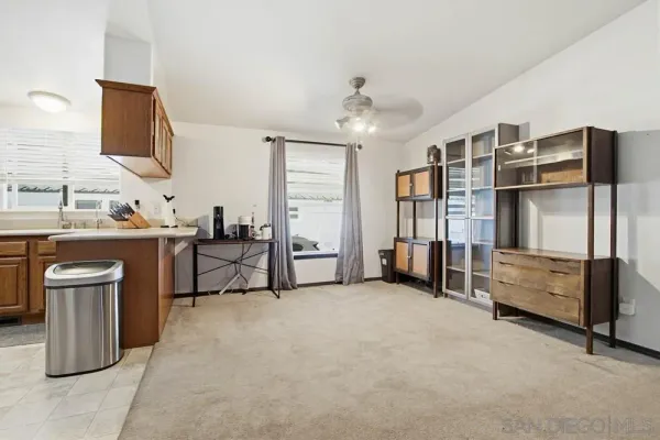 a living room with furniture and a flat tv screen