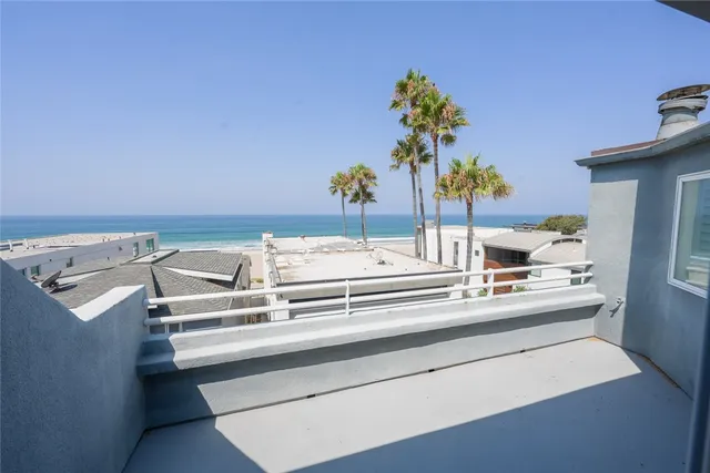 a view of a kitchen with stainless steel appliances