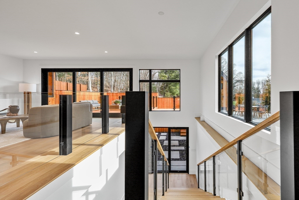 23 Dwight Road Needham, MA 02492 - Photo 17 of 40 a view of a living room with balcony and furniture