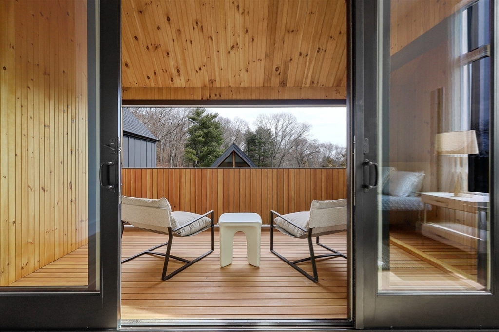 23 Dwight Road Needham, MA 02492 - Photo 31 of 40 a view of a chairs and table in the balcony