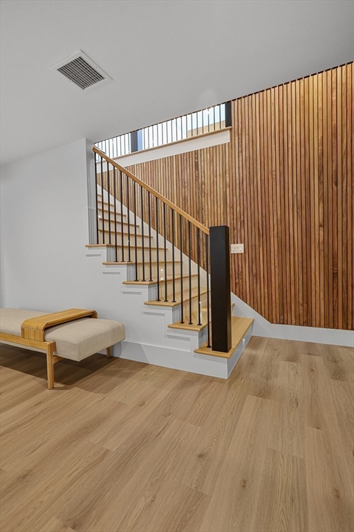 23 Dwight Road Needham, MA 02492 - Photo 32 of 40 a view of a hallway with wooden floor