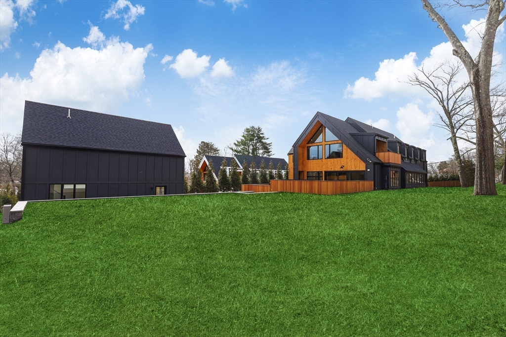 23 Dwight Road Needham, MA 02492 - Photo 40 of 40 a view of a house with backyard and garden