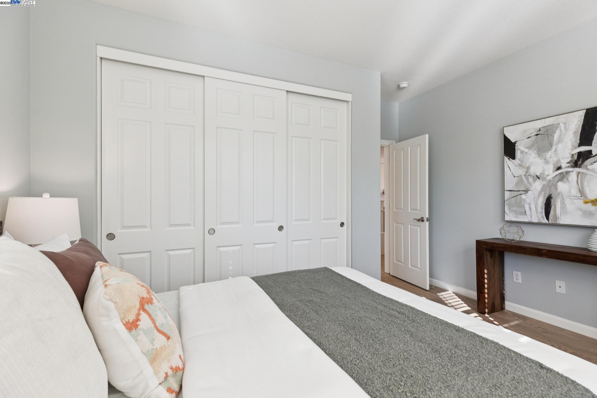 5 Cornelius Square Alameda, CA 94501 - Photo 12 of 60 a bedroom with a bed and a painting on the wall