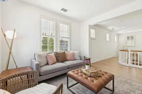 a spacious bedroom with a bed and a couch