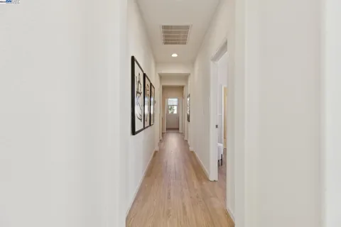 a bedroom with two beds and a large window
