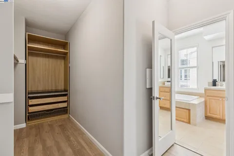 a white toilet sitting next to a bath tub