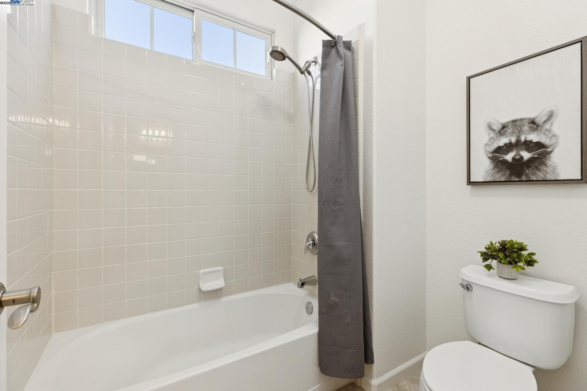 5 Cornelius Square Alameda, CA 94501 - Photo 38 of 60 a white toilet sitting next to a bath tub