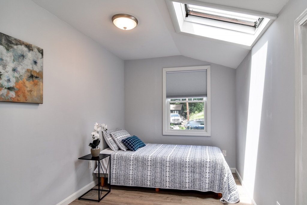 10 Ruth Drive Framingham, MA 01701 - Photo 19 of 28 a bedroom with a bed and window