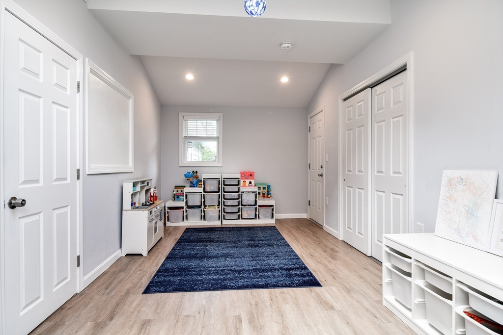10 Ruth Drive Framingham, MA 01701 - Photo 20 of 28 a living room with furniture and a wooden floor