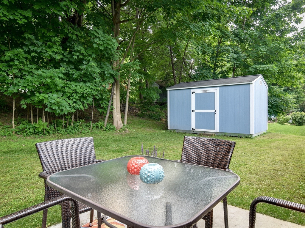 10 Ruth Drive Framingham, MA 01701 - Photo 25 of 28 a view of a backyard with furniture and a garden