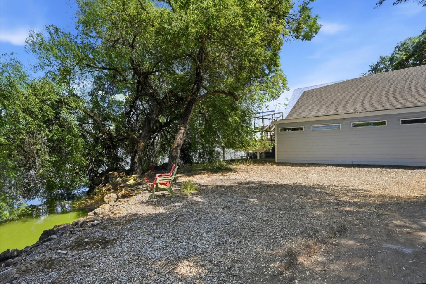 5156 Lake Road Lower Lake, CA 95457 - Photo 25 of 27 a backyard of a house with a yard and tree