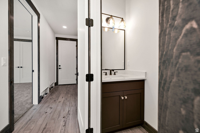 300 Knoll Loop, Unit 227 Fish Haven, ID 83287 - Photo 12 of 56 Bathroom with vanity, light wood-style floors, and recessed lighting