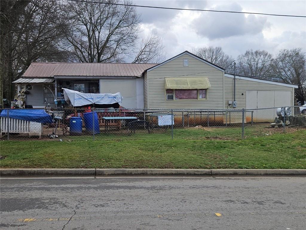 1322 Hazel Street Gainesville, GA 30501 - Photo 2 of 2 a front view of a house with garden