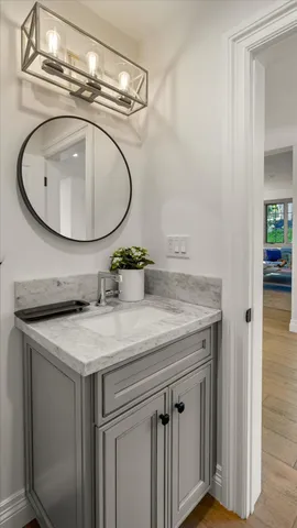 a white bath tub sitting in a bathroom next to a tub