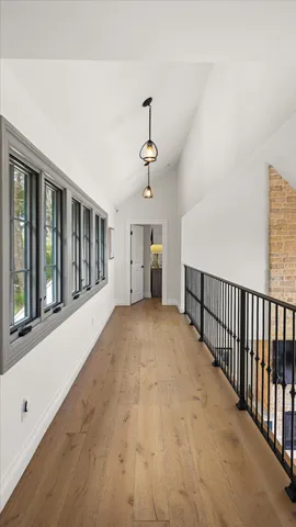 a bathroom with a granite countertop sink a mirror and shower