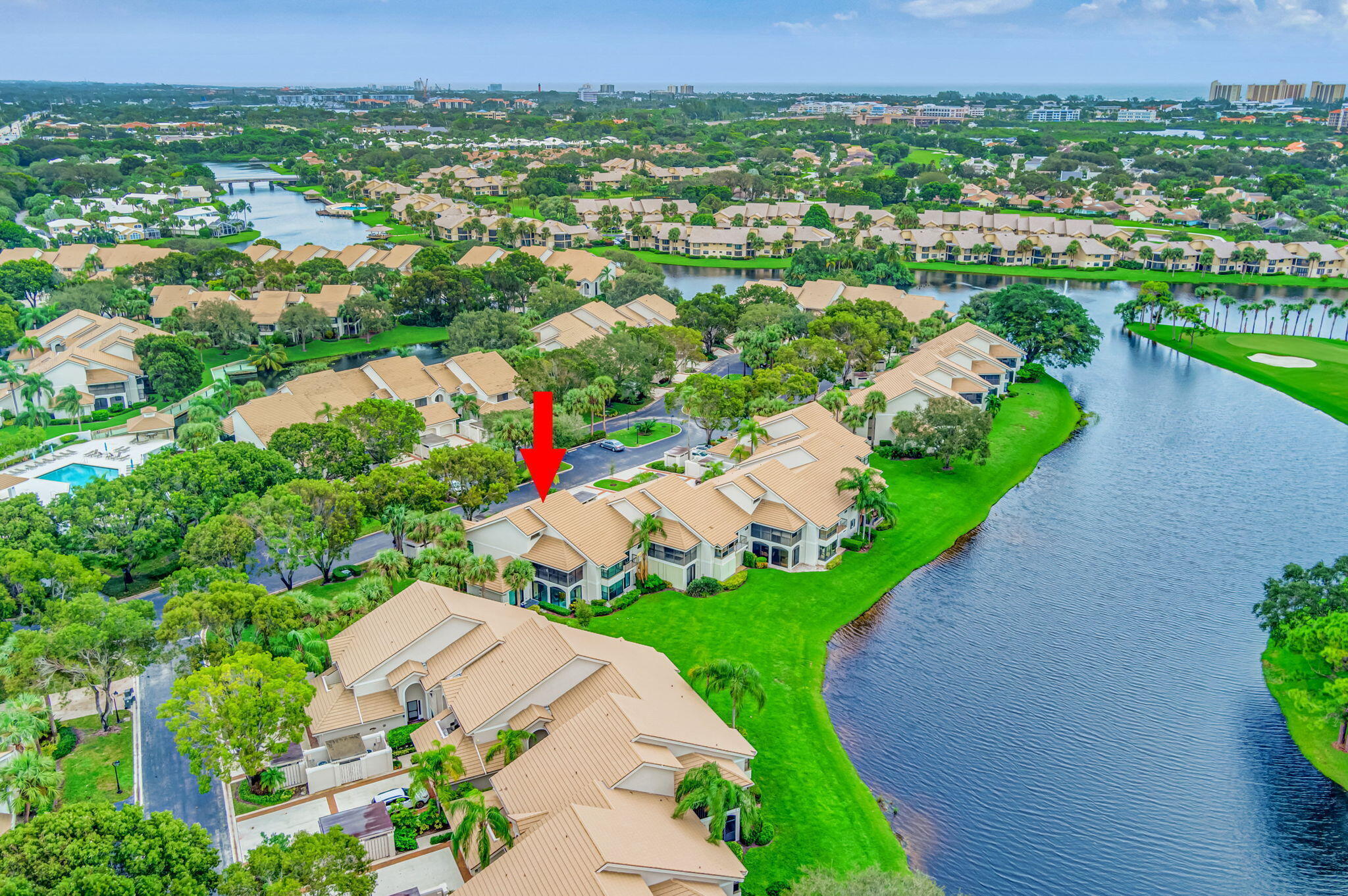 3940 Back Bay Drive, Unit 241 Jupiter, FL 33477 - Photo 19 of 19 an aerial view of green landscape with trees houses and lake view