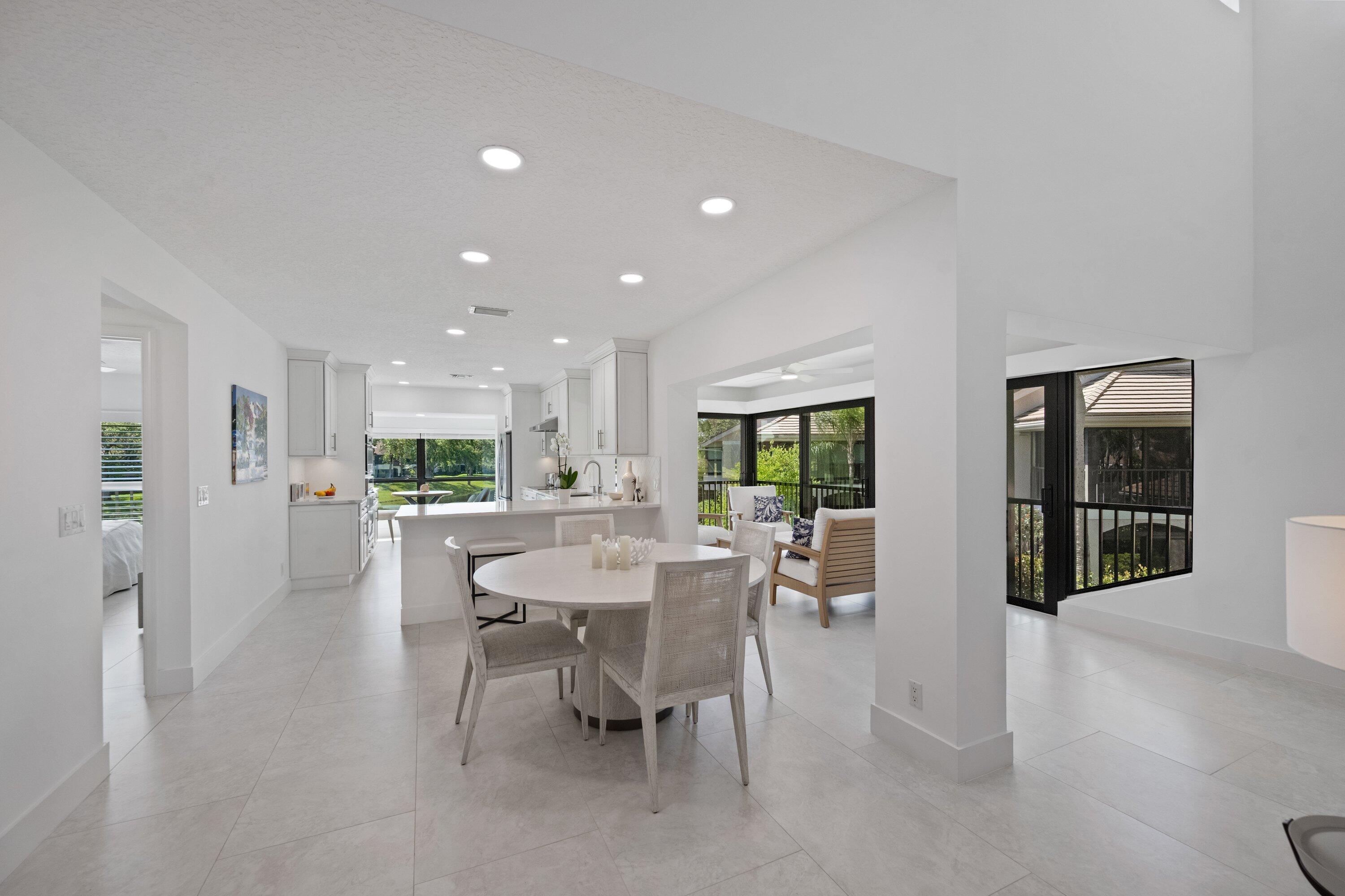 3940 Back Bay Drive, Unit 241 Jupiter, FL 33477 - Photo 7 of 19 a view of a dining room with furniture