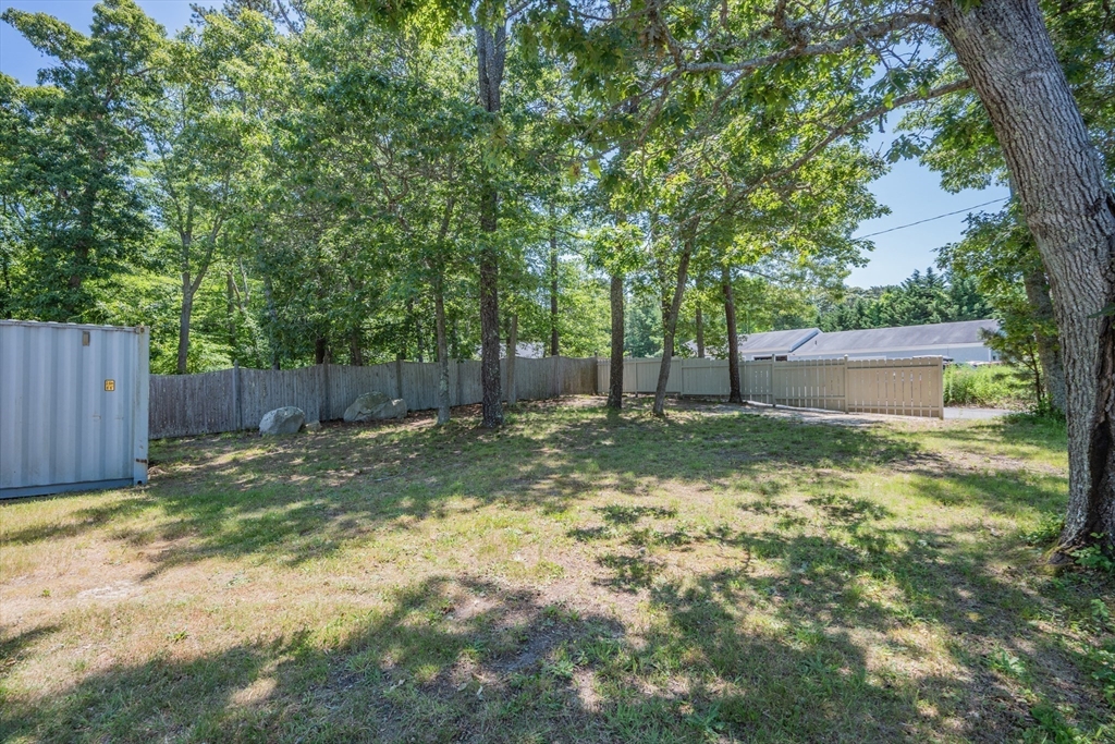 0 Underpass Road Brewster, MA 02631 - Photo 14 of 18 a backyard of a house with lots of green space