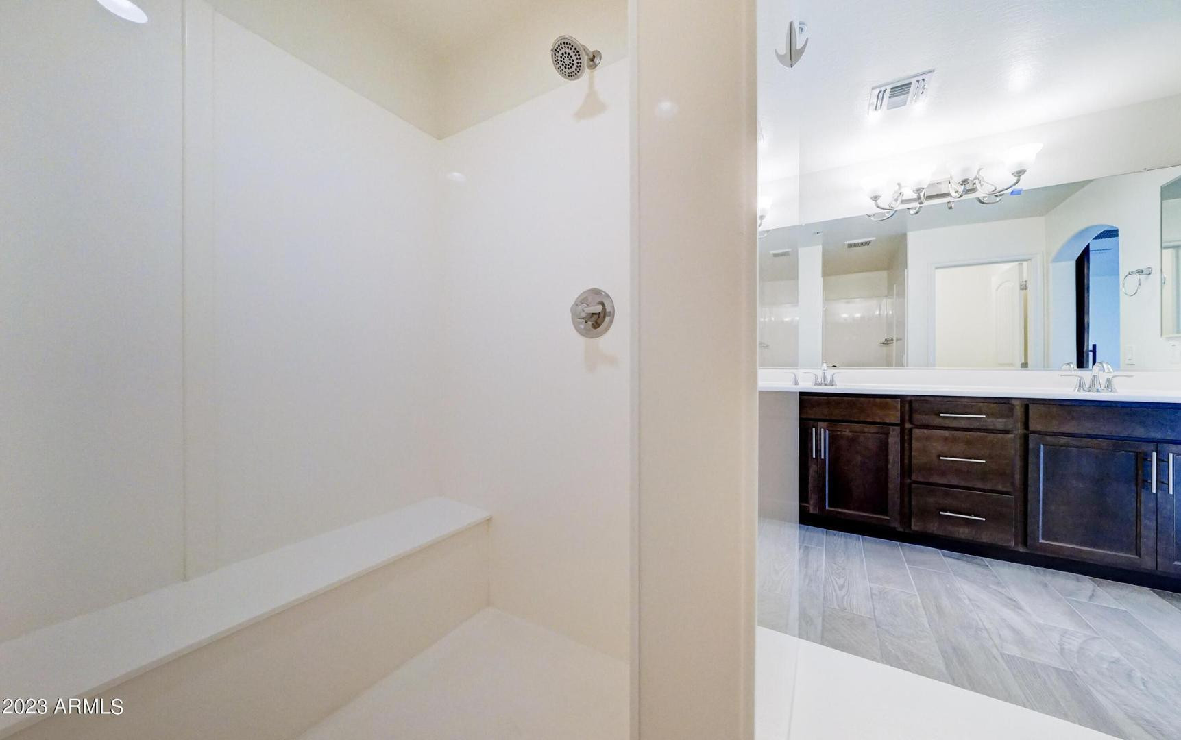 2297 North Alsap Road Buckeye, AZ 85396 - Photo 17 of 36 a bathroom with a double vanity sink and a mirror