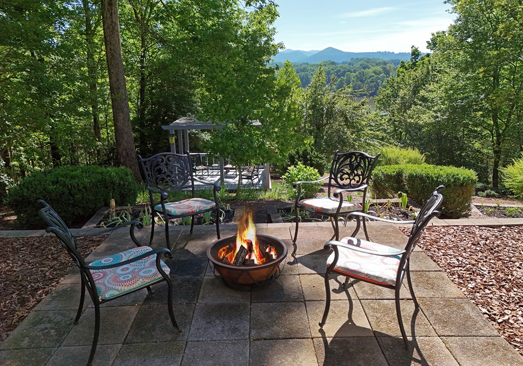 382 Pat Colwell Road Blairsville, GA 30512 - Photo 11 of 42 a view of a chairs and table in backyard