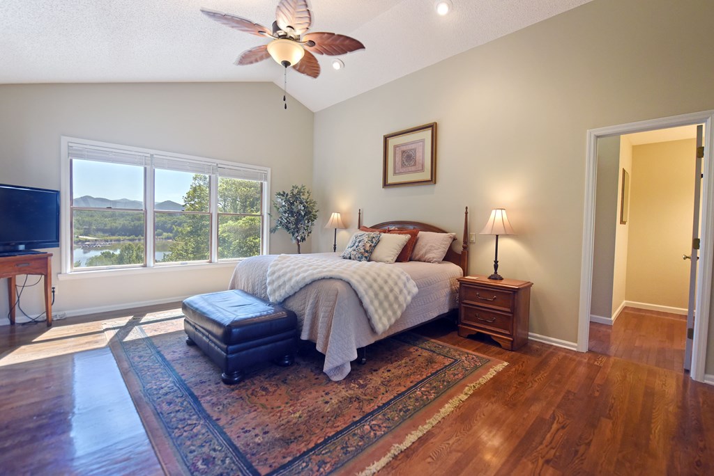 382 Pat Colwell Road Blairsville, GA 30512 - Photo 14 of 42 a bedroom with a large bed and a couch