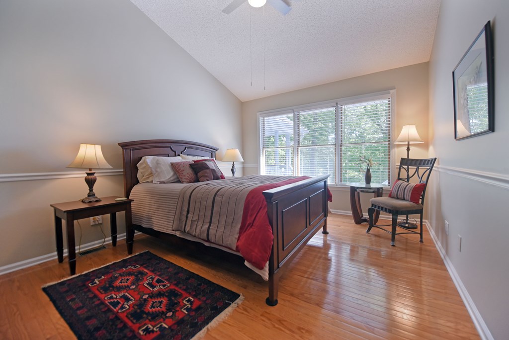 382 Pat Colwell Road Blairsville, GA 30512 - Photo 24 of 42 a bedroom with a bed and wooden floor