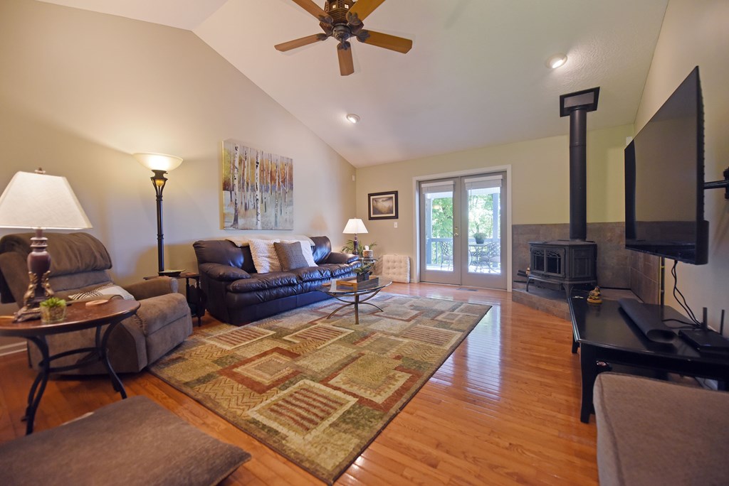 382 Pat Colwell Road Blairsville, GA 30512 - Photo 26 of 42 a living room with furniture fireplace and a window