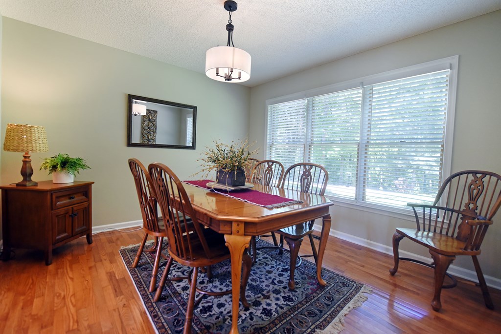 382 Pat Colwell Road Blairsville, GA 30512 - Photo 27 of 42 a view of a dining room with furniture window and wooden floor
