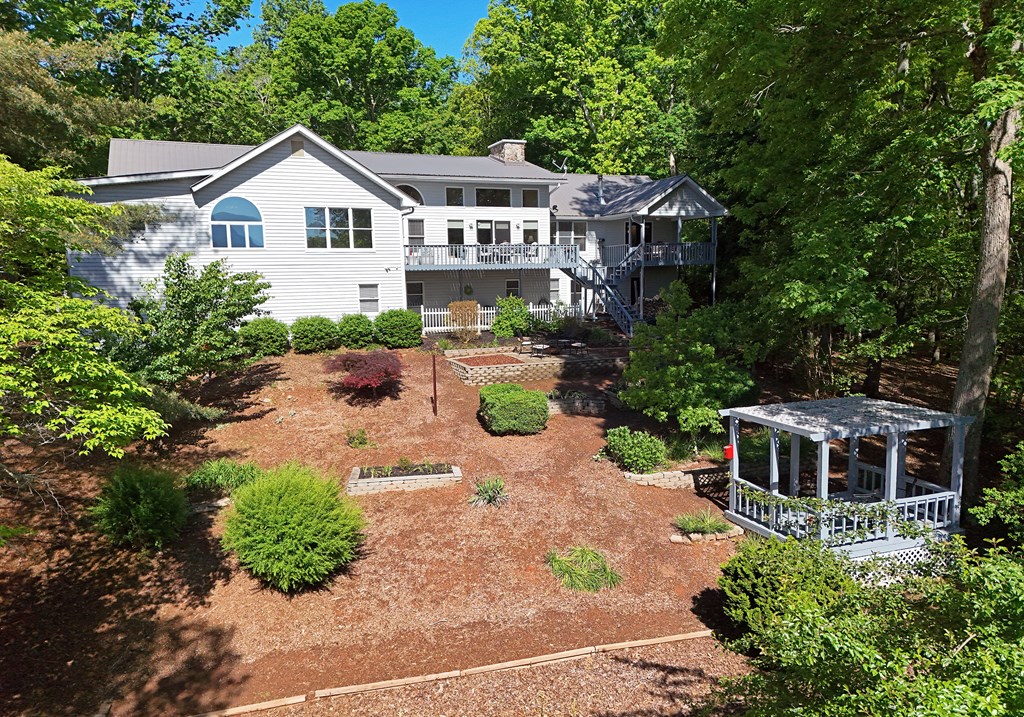 382 Pat Colwell Road Blairsville, GA 30512 - Photo 3 of 42 a front view of a house with a yard and potted plants
