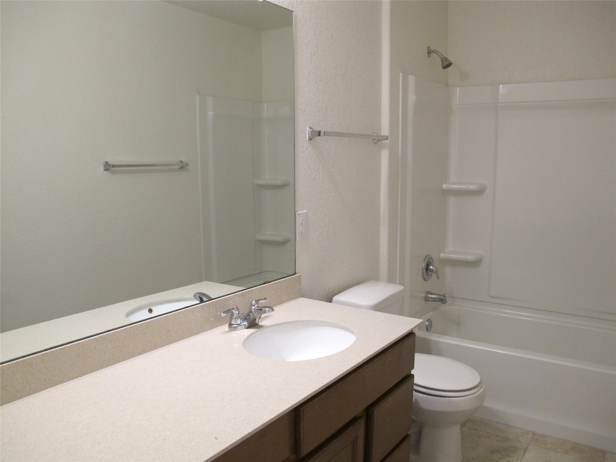 7820 Big Wind Way Austin, TX 78724 - Photo 30 of 37 a bathroom with a sink a toilet and shower
