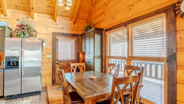 a kitchen with stainless steel appliances granite countertop a sink and a refrigerator