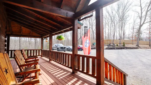 a view of a balcony with wooden floor