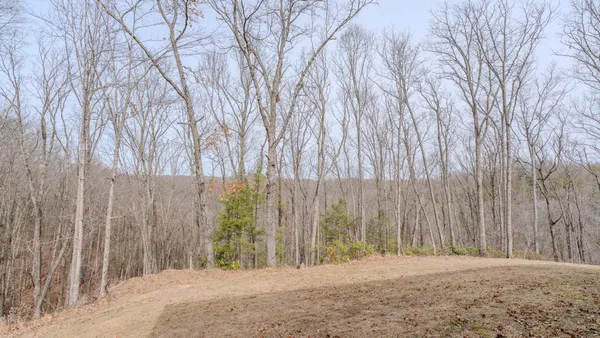 a bed room with a bed and a tv