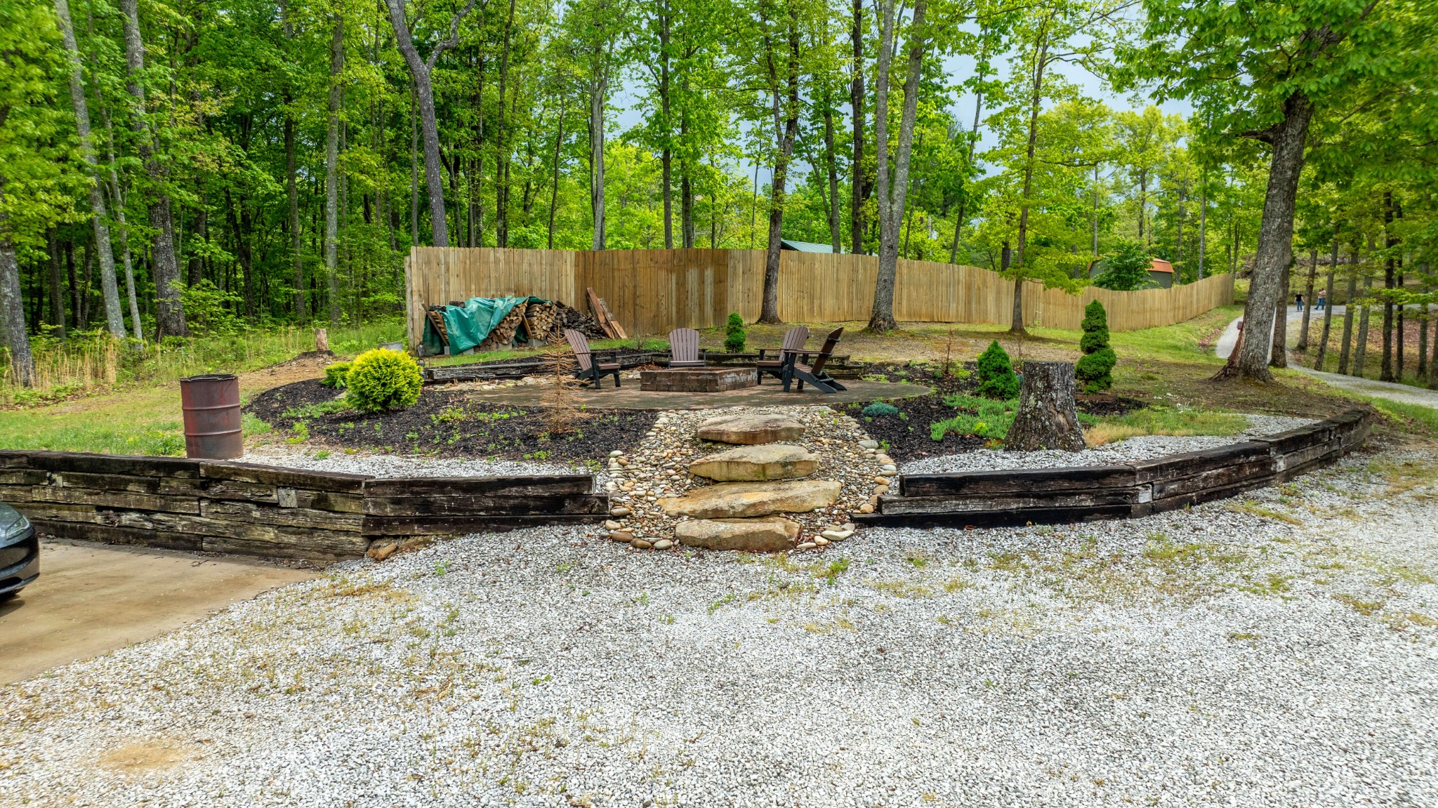336 John J Smith Road Oneida, TN 37841 - Photo 58 of 61 a view of a backyard with table and chairs plants and large trees