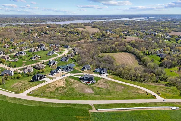 an aerial view of a residential houses with outdoor space