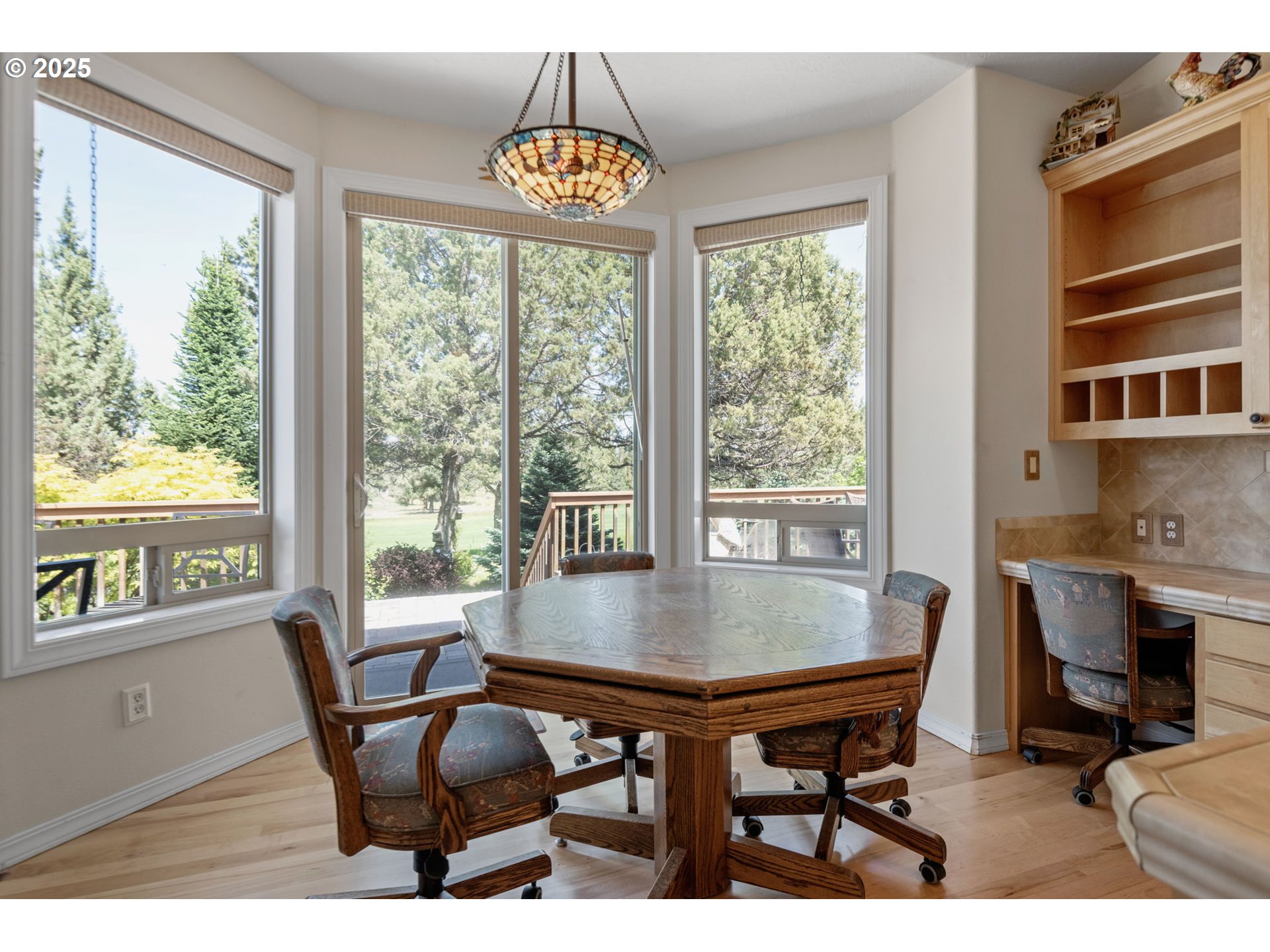 454 Tanager Drive Redmond, OR 97756 - Photo 12 of 31 a view of a dining room with furniture window and outside view