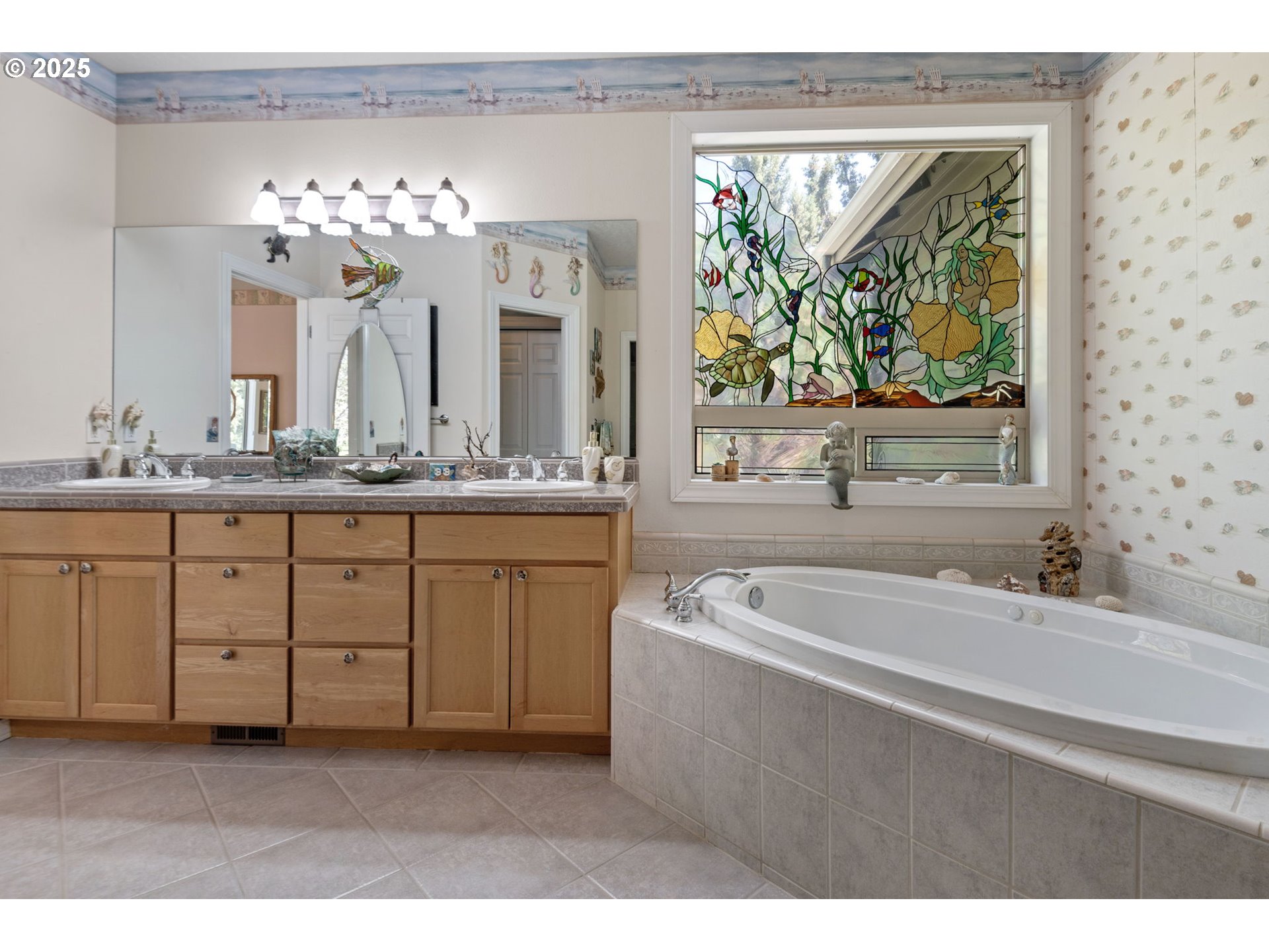 454 Tanager Drive Redmond, OR 97756 - Photo 17 of 31 a spacious bathroom with a double vanity sink a large mirror a bathtub and window
