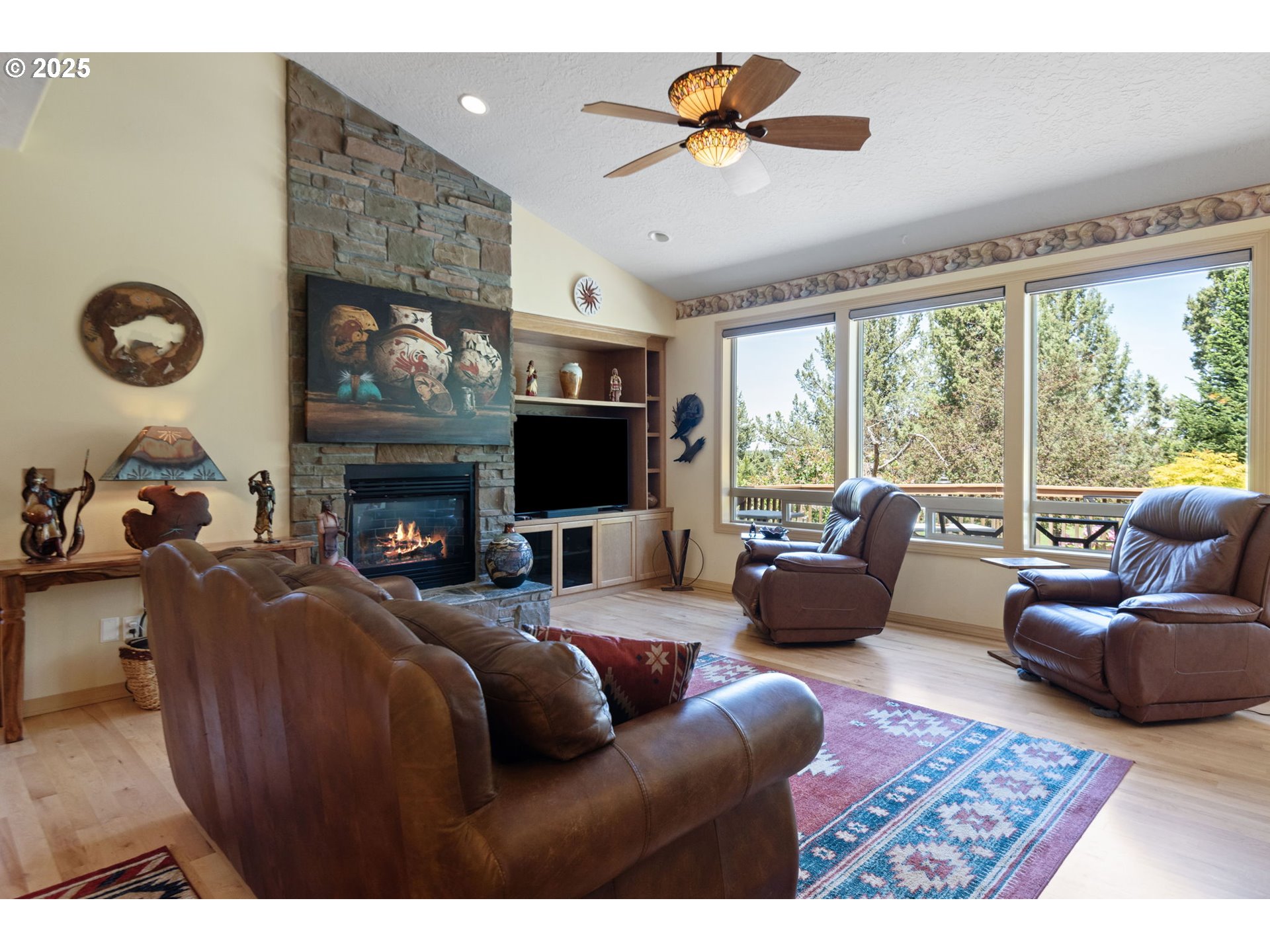 454 Tanager Drive Redmond, OR 97756 - Photo 7 of 31 a living room with furniture a fireplace and a flat screen tv