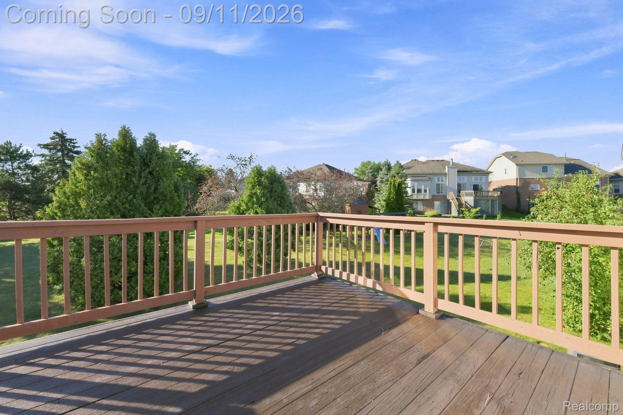 3201 Lynhurst Court Rochester, MI 48306 - Photo 37 of 43 Expansive outdoor deck with wood-finish flooring and wood railing