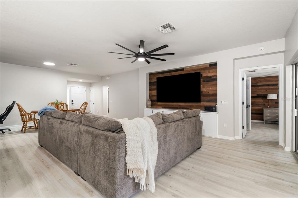 4098 Southwest 47th Court Ocala, FL 34474 - Photo 24 of 44 a living room with furniture and a flat screen tv