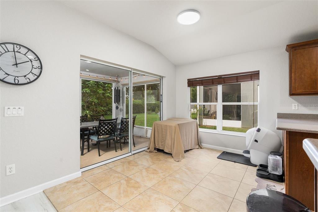4098 Southwest 47th Court Ocala, FL 34474 - Photo 28 of 44 a living room with furniture a window and a fireplace