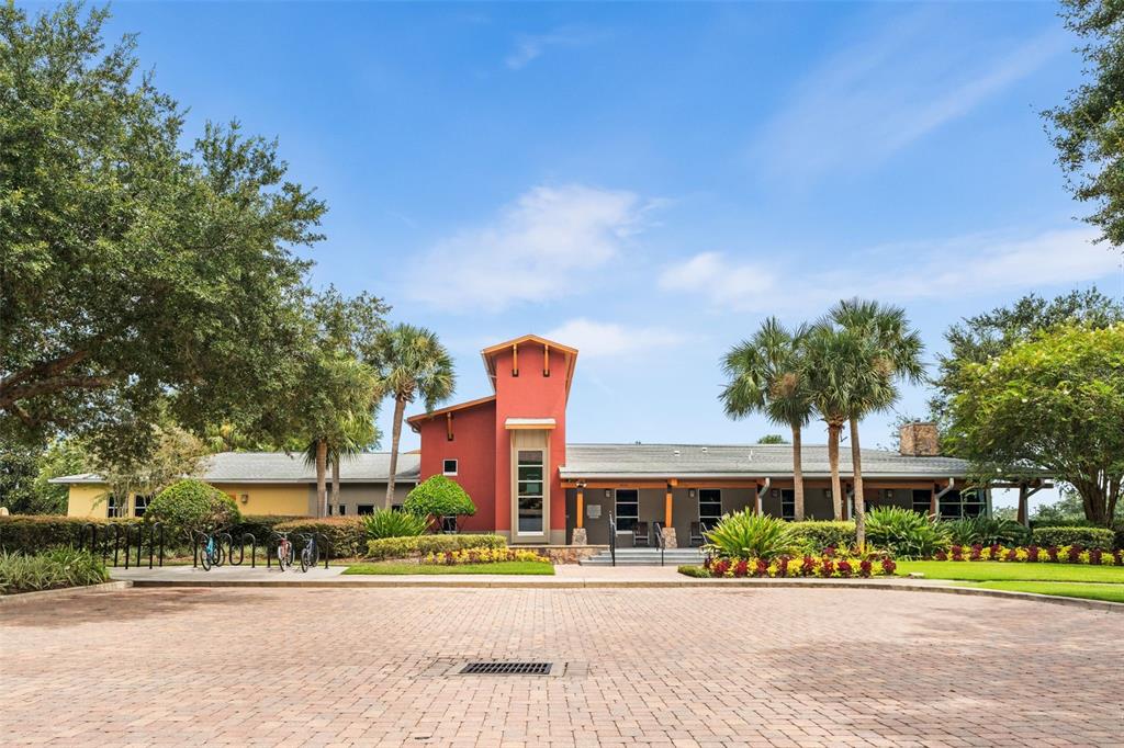 4098 Southwest 47th Court Ocala, FL 34474 - Photo 36 of 44 front view of a building with a garden